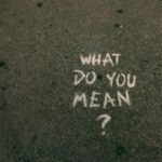 what do you mean? text on gray surface